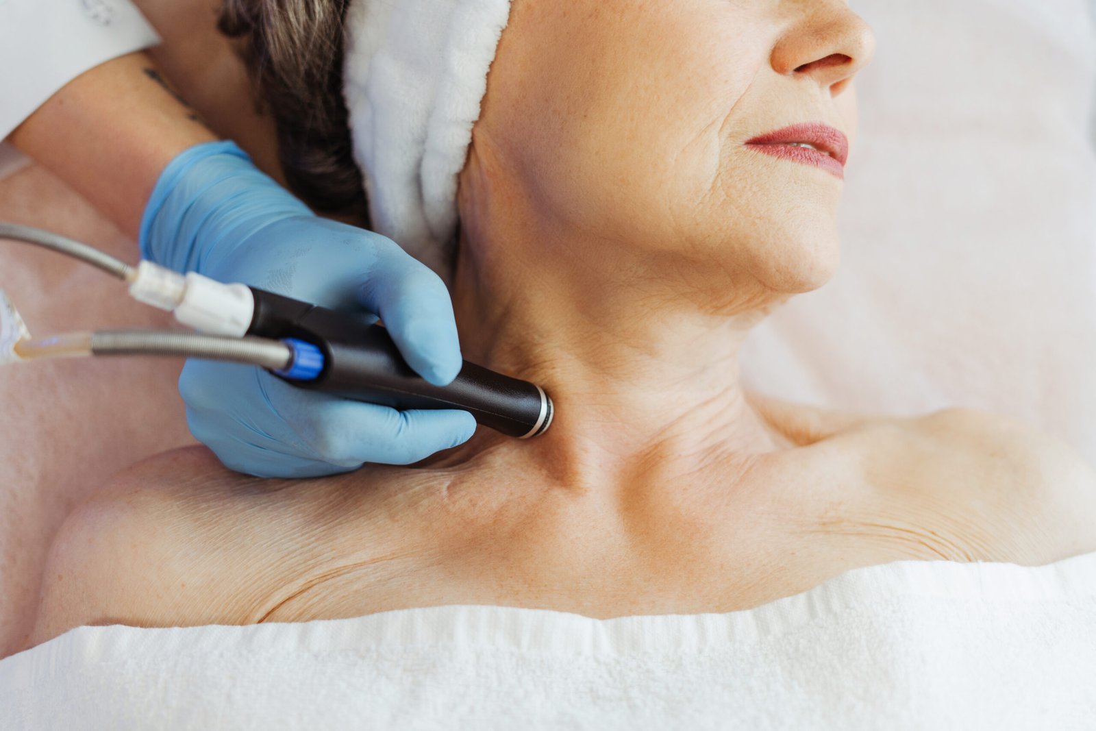 Dermatologist performing neck rejuvenation treatment at Couture Dermatology and Laser Beverly Hills Beverly Hills