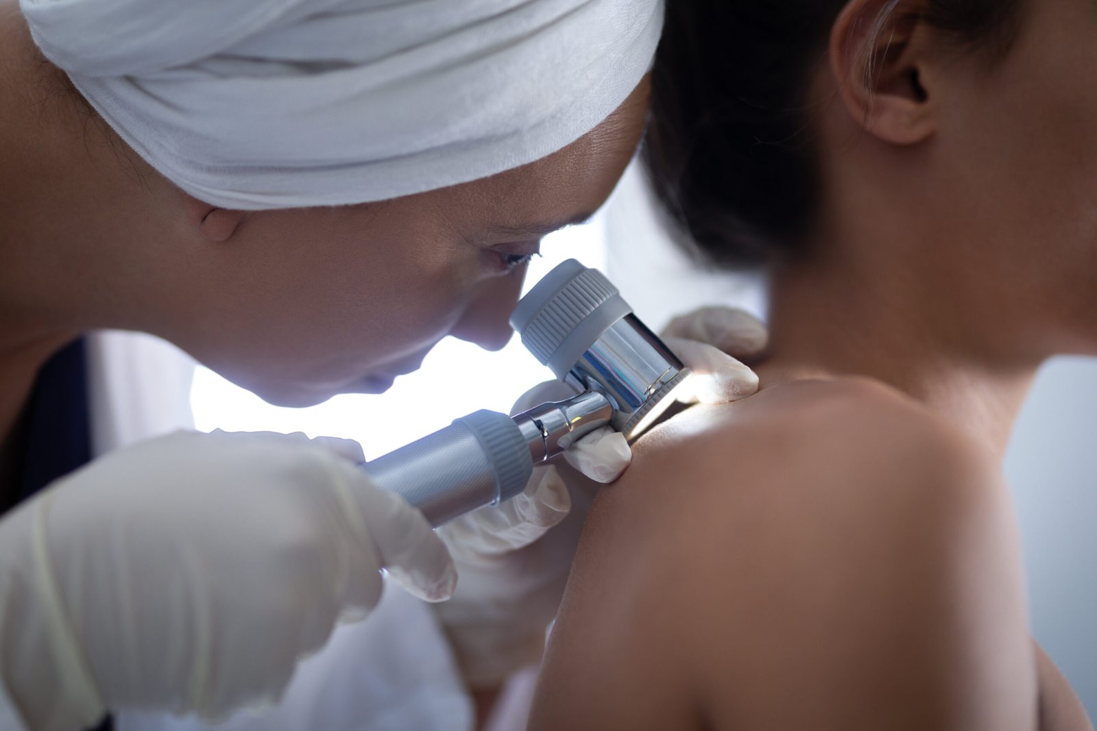 Female dermatologist performing full body skin examination at Couture Dermatology and Laser Beverly Hills